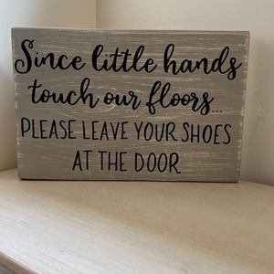 Wood sign “Since little hands touch our floors..”